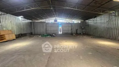 Spacious industrial warehouse with high ceilings and ample storage potential.