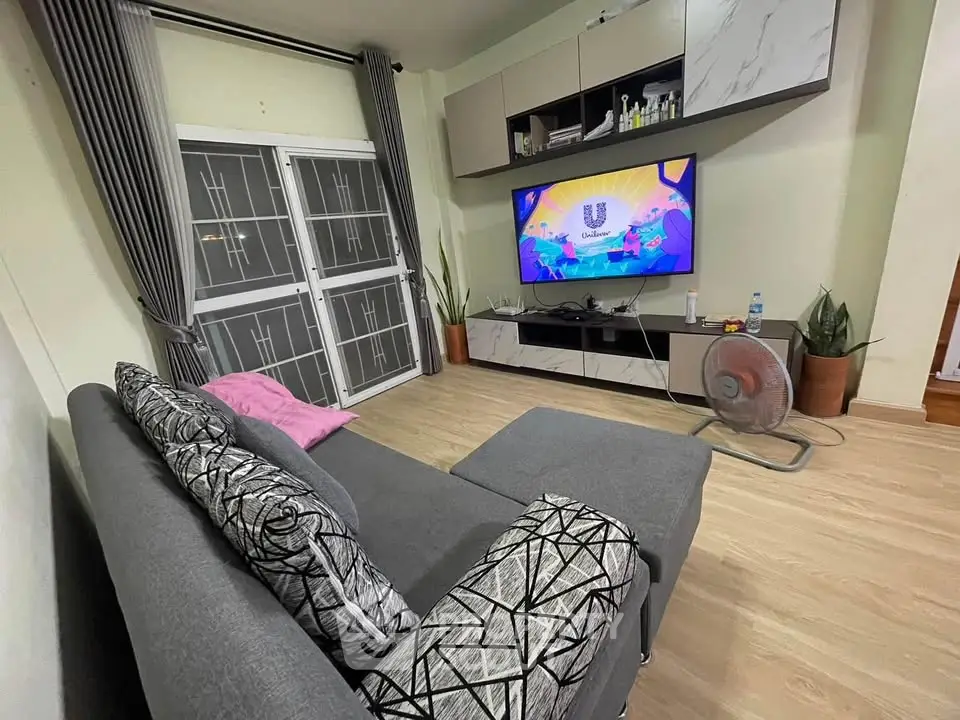 Modern living room with stylish sofa and entertainment center