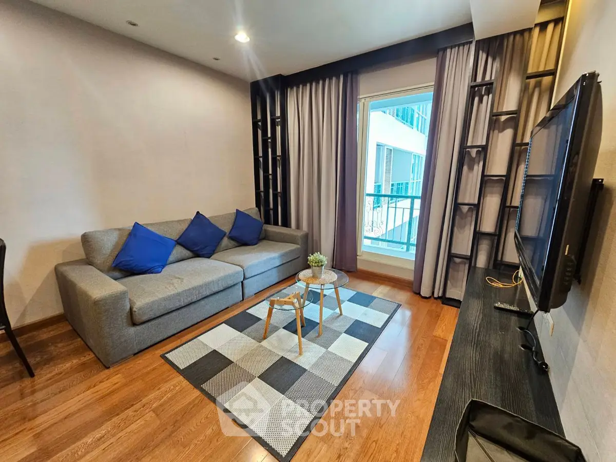 Modern living room with cozy sofa and stylish decor in a contemporary apartment.