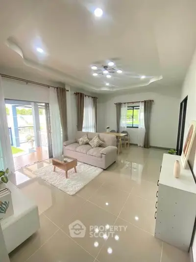 Spacious modern living room with elegant decor and natural light