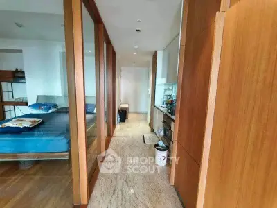 Modern apartment interior with wooden accents and open kitchen layout
