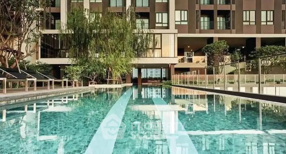 Luxurious apartment building with a stunning outdoor pool and modern design.