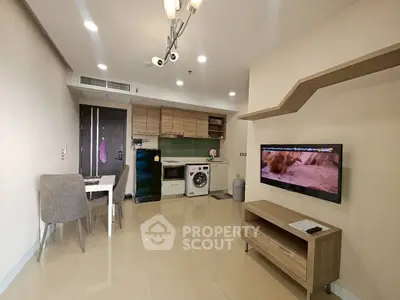 Modern living room with integrated kitchen and sleek appliances