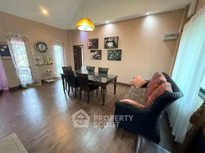 Elegant dining room with stylish decor and cozy seating, perfect for family gatherings.