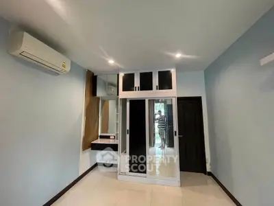 Spacious bedroom with built-in wardrobe and air conditioning