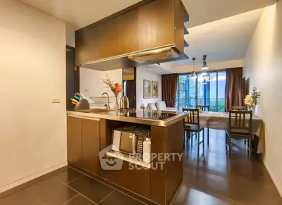 Modern open-layout kitchen and dining area with sleek design and natural light.