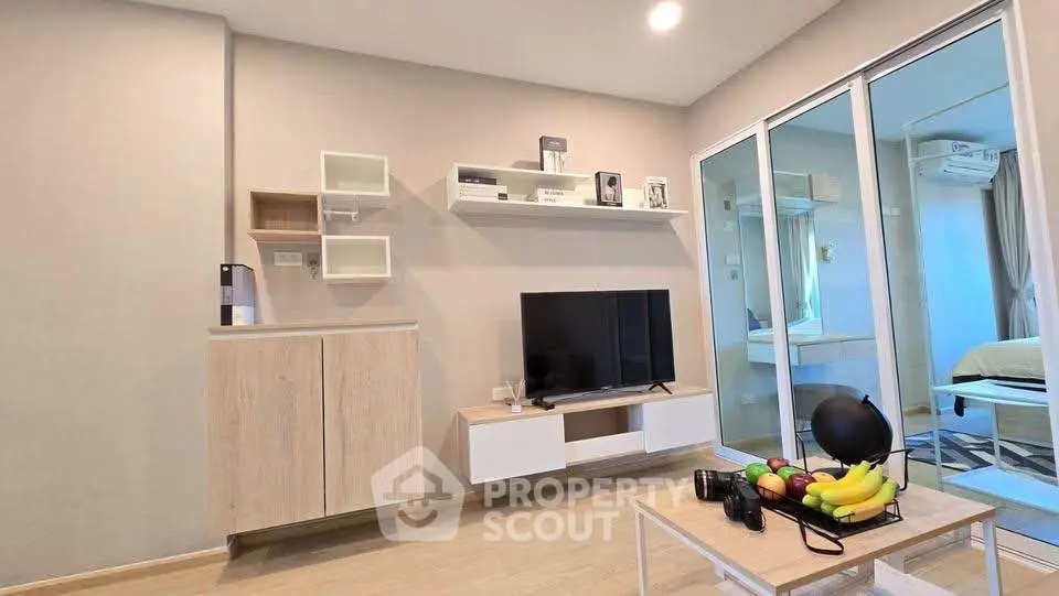 Modern living room with sleek TV unit and cozy decor