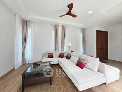 Spacious modern living room with elegant decor and cozy seating area.