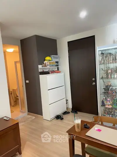 Cozy living space with modern decor and display cabinet