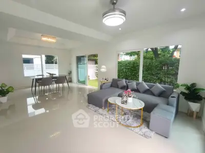 Spacious modern living room with elegant decor and garden view