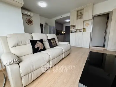 Modern living room with stylish beige sofa and sleek wooden flooring