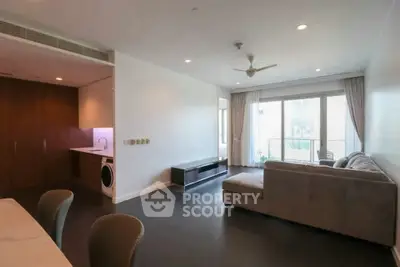 Spacious modern living room with open layout and balcony access
