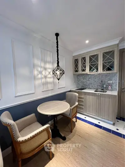 Charming kitchen with elegant dining area and stylish lighting