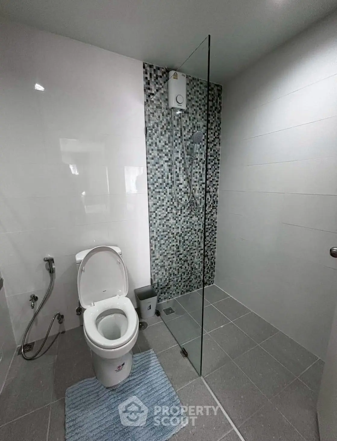 Modern bathroom with glass shower and sleek tile design