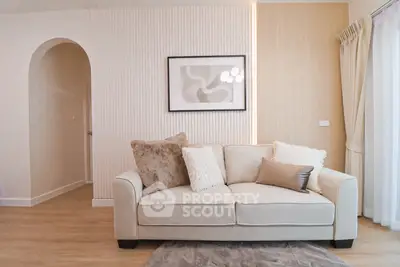 Elegant living room with cozy beige sofa and modern decor