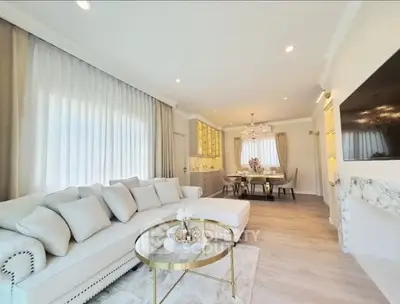 Luxurious living room with elegant decor and spacious dining area
