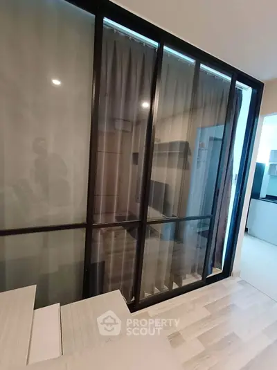 Modern apartment interior with glass partition and stylish flooring