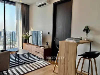 Modern living room with city view, stylish furniture, and natural light