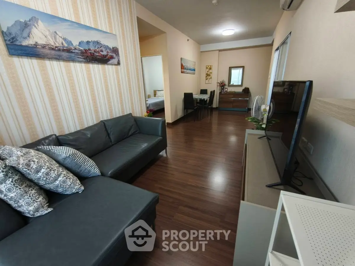 Spacious living room with modern decor and cozy seating area