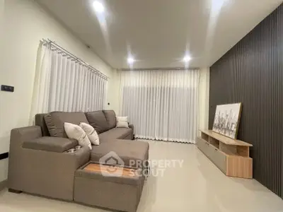 Modern living room with sleek furniture and ambient lighting