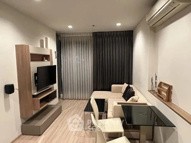 Modern living room with sleek furniture and air conditioning, perfect for comfortable urban living.