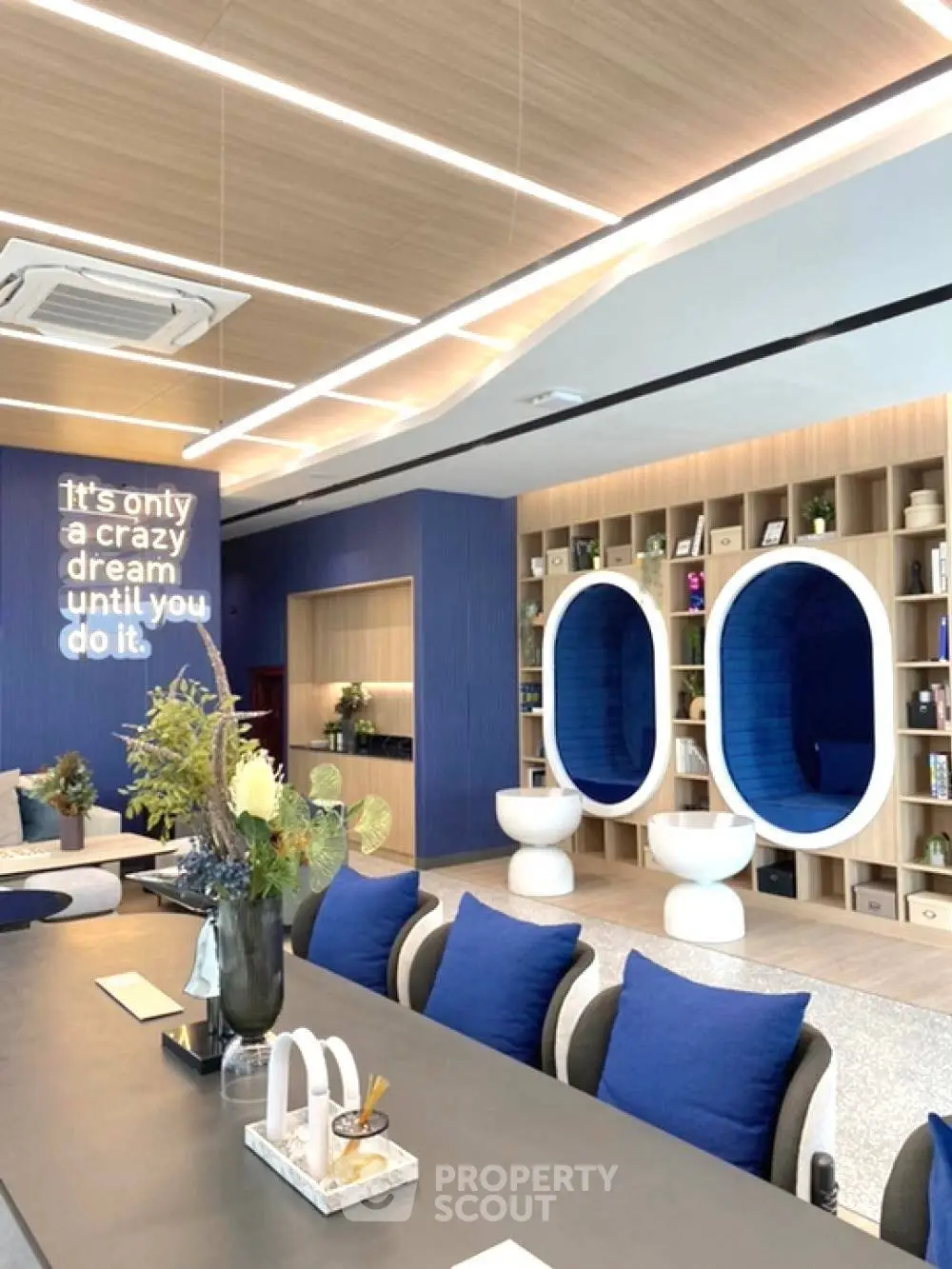 Modern co-working space with stylish seating and unique wall decor