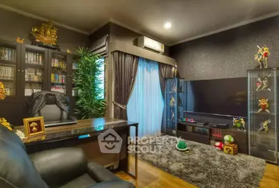 Luxurious study room with elegant decor and modern entertainment setup
