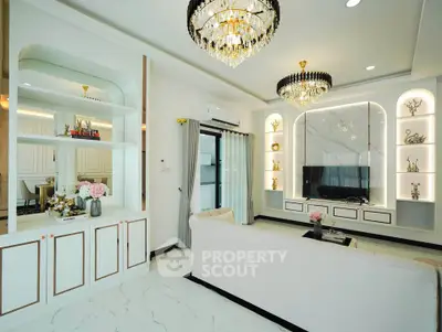 Luxurious living room with elegant chandeliers and modern decor