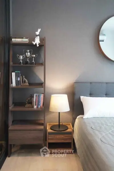 Modern bedroom with stylish bookshelf and cozy lighting