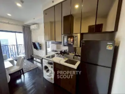 Modern kitchen with sleek appliances and open layout in a stylish apartment