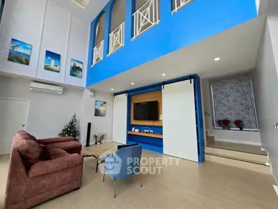 Spacious modern living room with high ceilings and stylish decor