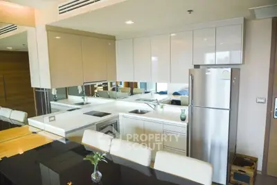 Modern kitchen with sleek design, featuring stainless steel appliances and a stylish breakfast bar.
