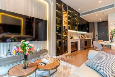 Luxurious modern living room with elegant decor and ambient lighting, featuring a large TV and stylish furniture.
