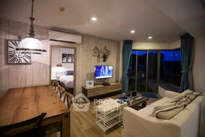Modern living room with open layout, stylish decor, and cozy ambiance in a contemporary apartment.