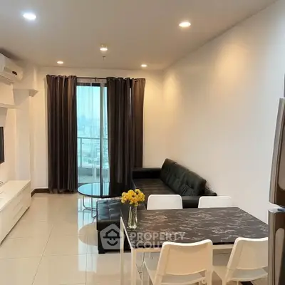 Modern living room with sleek furniture and city view, perfect for urban living.