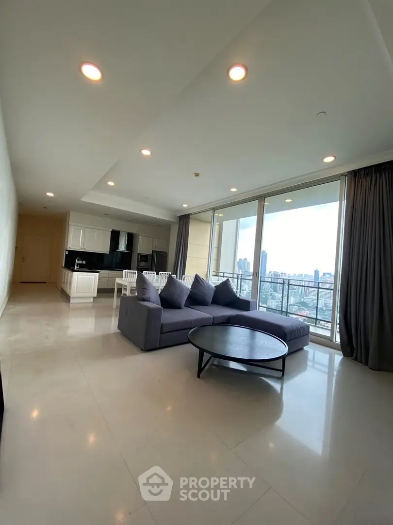 Spacious modern living room with city view and open kitchen layout