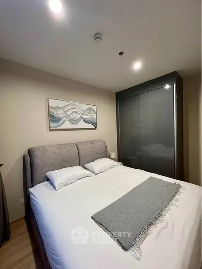 Cozy modern bedroom with stylish decor and comfortable bed