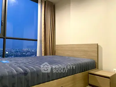 Modern bedroom with city view and stylish wooden furniture