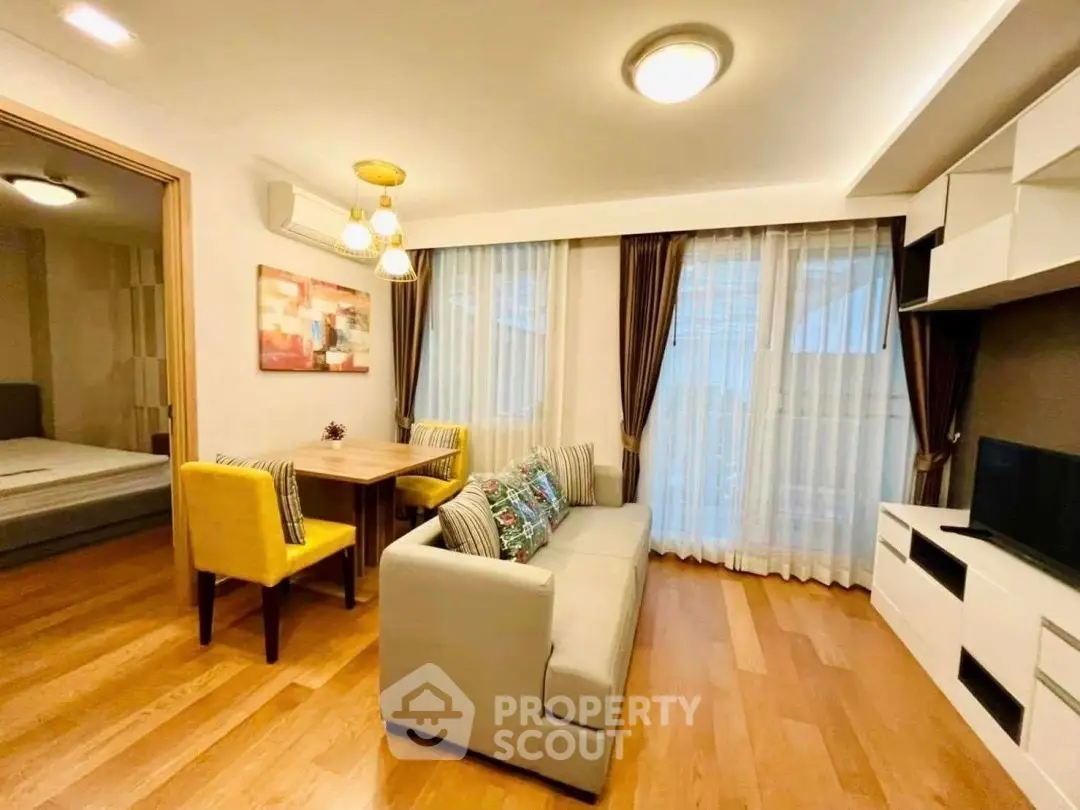 Charming living room with cozy seating and elegant decor, perfect for relaxation and entertainment.