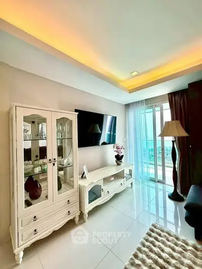 Elegant living room with modern decor and balcony view