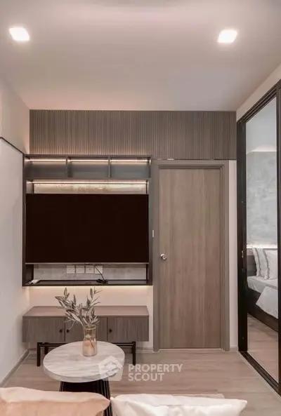 Modern living room with sleek design and stylish furniture, featuring a cozy ambiance and contemporary decor.