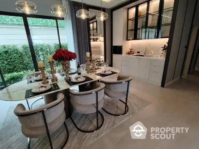 Luxurious dining area with elegant table setting and modern kitchen design