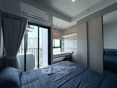 Modern bedroom with balcony view in high-rise apartment