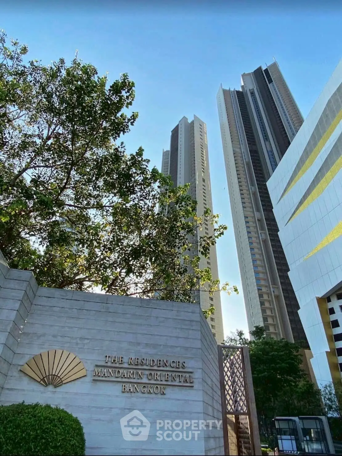 Luxurious high-rise residences at The Mandarin Oriental Bangkok with stunning architecture.