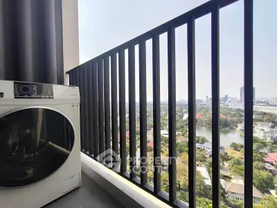 Stunning balcony view with cityscape and modern washing machine, perfect for urban living.