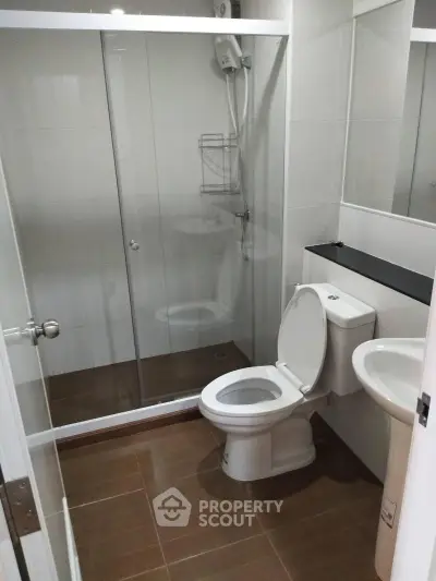 Modern bathroom with glass shower and sleek fixtures