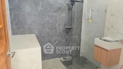 Modern bathroom with sleek shower and stylish tiles