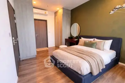 Modern bedroom with stylish decor and cozy ambiance, featuring a comfortable bed and elegant furnishings.