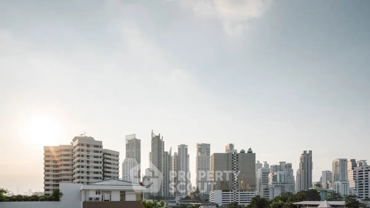 Stunning city skyline view with modern high-rise buildings at sunset, perfect for urban living enthusiasts.