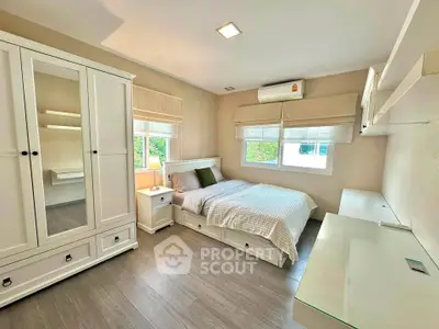 Bright and cozy bedroom with modern furnishings and natural light